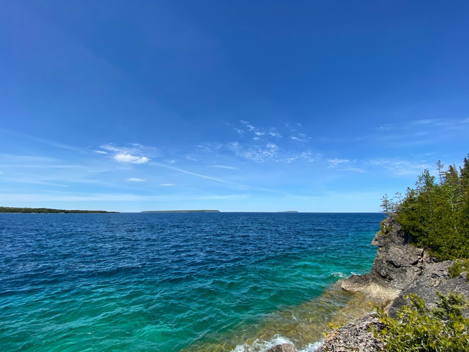 Clear blue Lake Huron water and rocky shoreline near Tobermory, Ontario